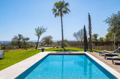 a swimming pool in the backyard of a house at Villa Oasis Del Mar by Algarve Vacation in Albufeira