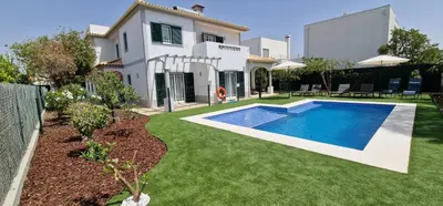 a house with a swimming pool in the yard at Villa Pretty Stunning House with Garden and Private Swimming Pool in Almancil
