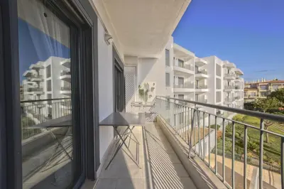 a balcony with a view of a building at Vista das Ondas - Apartamento 204 in Albufeira