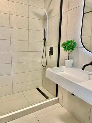 a bathroom with a sink and a shower at F&V Studio Vilamoura in Quarteira