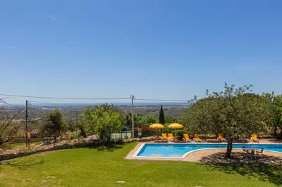 a view of a swimming pool in a resort at Vila Limão in Boliqueime