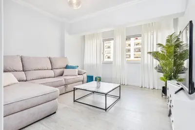 a living room with a couch and a coffee table at Ria Mar Deluxe - City Center @Homesbyfc in Faro