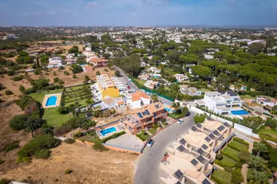 an aerial view of a villa with a resort at Villa Trindade in Albufeira