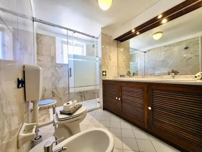 a bathroom with a toilet and a sink at Albufeira Sunset With Pool by Homing in Albufeira