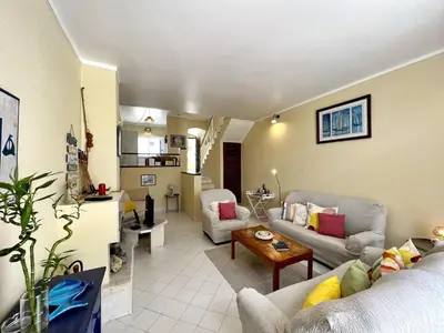 a living room with a couch and a table at Albufeira Sunset With Pool by Homing in Albufeira