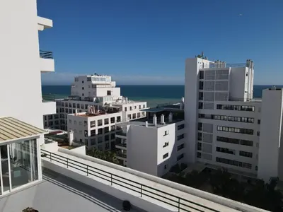 a view of the city from the balcony of a building at Ocean Blue in Quarteira