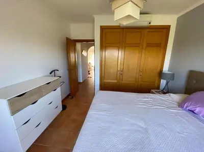 a bathroom with a toilet and a sink and a shower at Penthouse T2 pool Terrace time in Albufeira