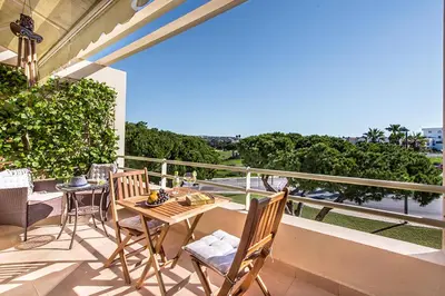 a patio with a table and chairs on a balcony at Casa dos Salgados in Guia