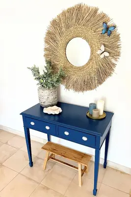 a blue dresser with a mirror on a wall at Detailed Villa - In Vilamoura's Heart in Vilamoura