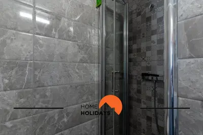 a bathroom with a shower with the words home huddles at #267 Cozy Villa Casablanca in Albufeira
