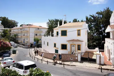 a white house on the side of a street at Mar Azul 4 in Albufeira