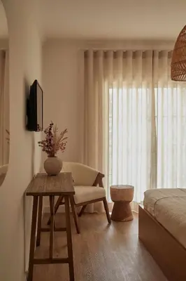 a bedroom with a bed and a couch and a table at Casa Terra with Pool & Free WiFi in Albufeira