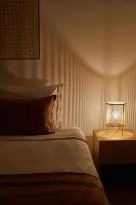 a bedroom with a bed and a lamp on a table at Casa Terra with Pool & Free WiFi in Albufeira