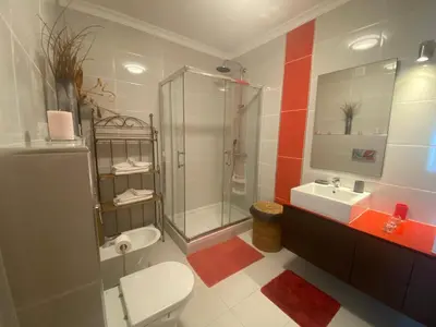 a bathroom with a toilet and a shower and a sink at Villa Jardins 3 by Sunny Deluxe in Albufeira