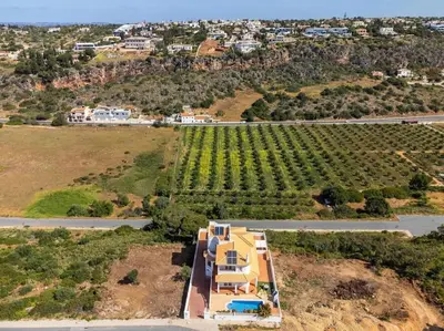 an aerial view of a house on a hill with a vineyard at Villa Chris by Gabi Miguel in Albufeira