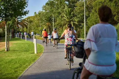 a group of people riding bikes down a sidewalk at Marina Vilamoura - Aquamar 201 - By Vilamoura Sun in Quarteira