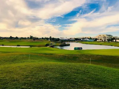 a view of a golf course with a river at Marina Vilamoura - Aquamar 009 - By Vilamoura Sun in Loulé