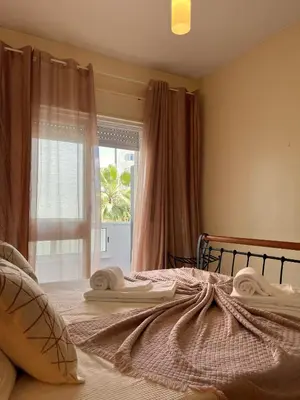 a bedroom with a bed with towels on it at Julias Beach Retreat in Quarteira