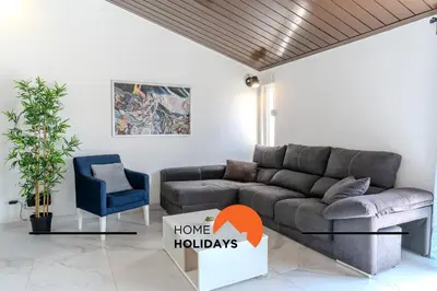 a living room with a couch and a chair at #265 Charming Villa Sam in Albufeira