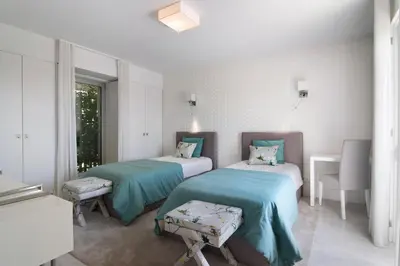 a hospital room with two beds and a window at Sweet Home Albufeira in Albufeira