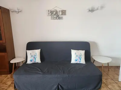 a bed with two pillows on it in a room at L&J Ocean View Apartment in Albufeira