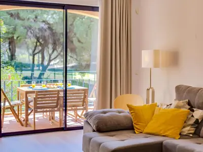 a living room with a couch and a table at AL - Apartamento Vila Sol AG in Vilamoura