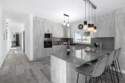 a kitchen with a table and some chairs in it at Villa Flora in Algoz