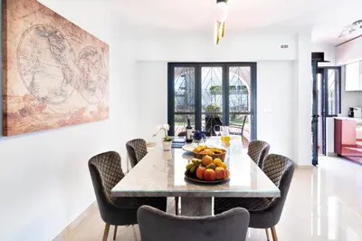 a dining room with a table with fruit on it at Vilamoura Marina Villa in Vilamoura