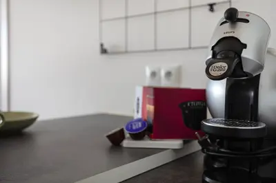 a coffee maker sitting on top of a kitchen counter at Quarteira SeaViews in Quarteira
