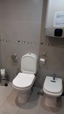 a bathroom with a toilet and a bidet at Quarteira Apartamento T2 - Oceanides in Quarteira