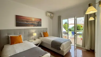 a bedroom with two beds and a window at Solar by Check-in Portugal in Albufeira