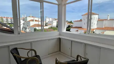 two chairs in a room with two windows at Solar by Check-in Portugal in Albufeira