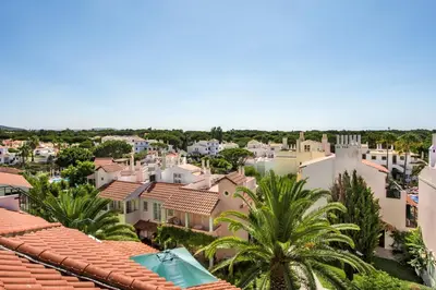 a view from the roof of a town at Spacious 3BR Apartment in Vilamoura Old Village with Rooftop BBQ, Pools & Panoramic Views in Quarteira