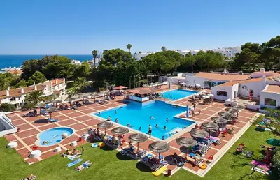 an overhead view of a swimming pool with people sitting around it at Sea & Oldtown View in Albufeira